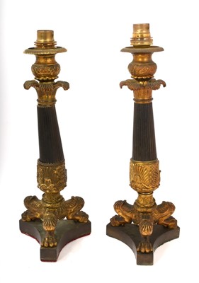 Lot 850 - Pair of Regency bronze candlesticks