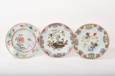 Lot 75 - Three 18th century Chinese famille rose porcelain plates, decorated with deer, cockerels, and birds