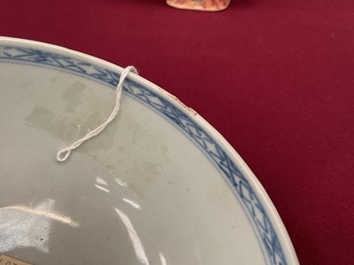 Lot 69 - Chinese blue and white porcelain bowl from the Nanking Cargo, painted with a landscape, label to base, 15cm diameter