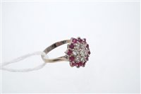 Lot 767 - Ruby and diamond cluster ring, the hexagonal...