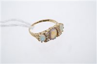 Lot 776 - Opal and diamond ring with three oval opal...