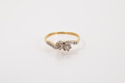 Lot 292 - 18ct gold diamond two stone ring in a platinum cross over setting