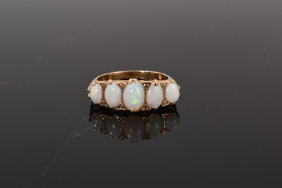 Lot 42 - Victorian style 9ct gold opal five stone ring with five graduated oval cabochon opals in carved gold setting