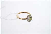 Lot 783 - Diamond and peridot ring with a marquise-shape...