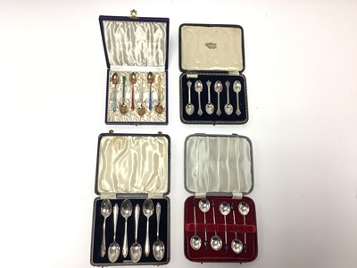 Lot 305 - Four sets of silver coffee spoons to include silver gilt and enamel, all boxed