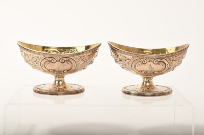 Lot 346 - Pair of George III silver boat shaped salts with gilded interiors