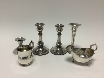 Lot 364 - Pair of silver candlesticks, spill vase, sauce boat, christening mug and a dwarf candlestick