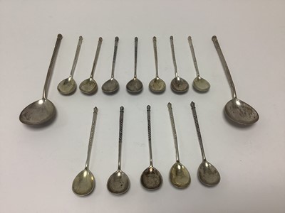 Lot 356 - Group of twelve Russian silver niello work spoons and two others larger