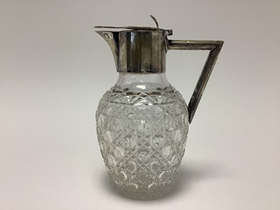 Lot 357 - Edwardian glass hobnail claret jug with silver plated mount