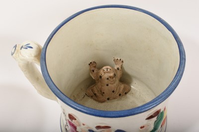 Lot 76 - Two 19th century Staffordshire pottery ‘frog’ mugs