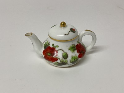 Lot 680 - Derby (King Street Works) miniature teapot and cover, painted with poppies