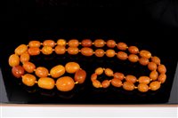 Lot 805 - Large amber bead necklace with a string of...