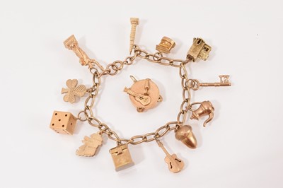 Lot 65 - 9ct gold charm bracelet with various gold novelty charms