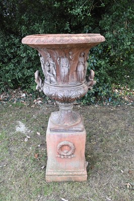 Lot 1176 - Large terracotta-style garden urn on plinth