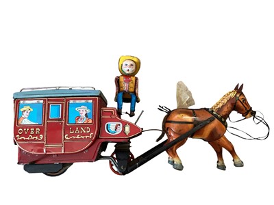 Lot 62 - Tinplate Cragstan Overland Stage Coach battery operated, Peter Pan Automatic chocolate machine, Two Performing Monkiees and some friction cars (qty)