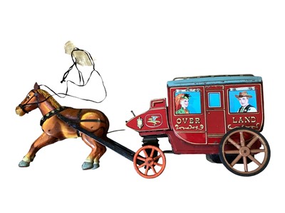 Lot 62 - Tinplate Cragstan Overland Stage Coach battery operated, Peter Pan Automatic chocolate machine, Two Performing Monkiees and some friction cars (qty)