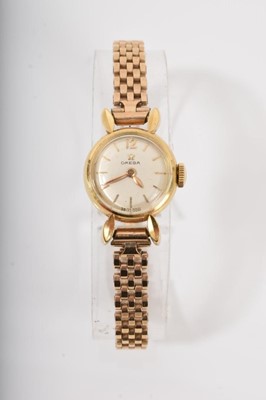 Lot 587 - 1950s ladies Omega gold wristwatch with a Omega 17 jewel 213 calibre mechanical movement in 18ct gold case on a later 9ct gold bracelet