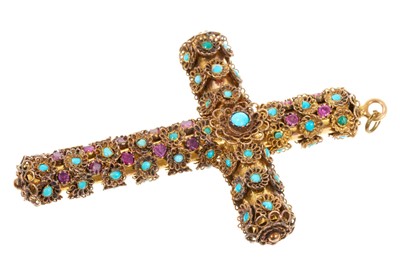 Lot 410 - 19th century continental ruby and turquoise cross pendant, the tubular yellow metal cross applied with yellow metal filigree rosettes set with mixed cut rubies and turquoise cabochons, 70mm