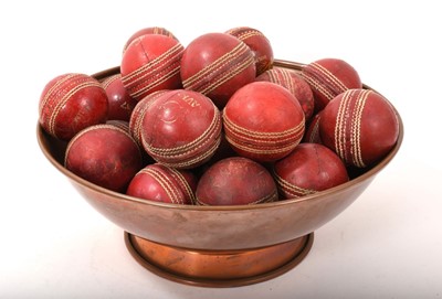 Lot 736 - Collection of vintage cricket balls presented in a copper bowl