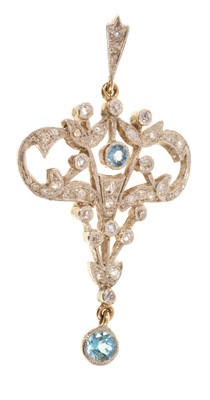 Lot 429 - Edwardian-style aquamarine and diamond pendant with two mixed cut aquamarines and old cut diamonds in openwork floral scrolls, 56mm.