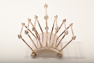 Lot 384 - Christopher Dresser for Hukin and Heath, a silver plated six division toast rack, circa 1881, model 2556