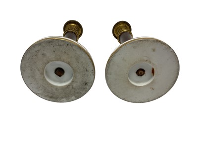 Lot 103 - Formerly the gift of Napoleon Bonaparte, Pair Early 19th century French Paris porcelain, simulated porphyry and ormolu mounted candlesticks