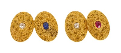 Lot 478 - Pair of Victorian 18ct gold and gem set cufflinks with old cut diamonds, a mixed cut ruby and blue sapphire on textured gold oval panels (London 1889)