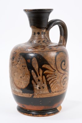 Lot 880 - Ancient Etruscan aryballos portrait ewer, with flared rim and loop handle, 19cm high