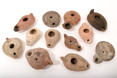 Lot 883 - Collection of Roman and ancient oil lamps. (12)