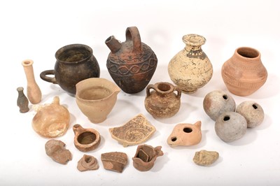 Lot 878 - Collection of ancient pottery and glass vessels, the tallest 19cm, and fragmentary pieces