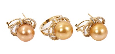 Lot 516 - Golden cultured pearl and diamond cocktail ring and matching pair of earrings