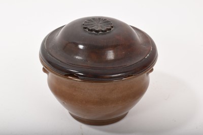 Lot 34 - Chinese/Japanese brown glazed bowl/censer, with flared rim and two 'prunt' handles, carved wooden lid, 10.75cm diameter