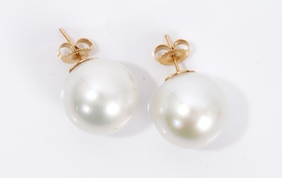 Lot 498 - Large pair of cultured pearl earrings each with a 16mm diamater cultured pearl with gold post and butterfly fittings, stamped 14K