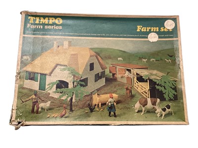 Lot 81 - Timpo Farm Series Farm Set 159, boxed (damaged corner) and Crescent ModelFarm lead figures, boxed (poor) (2)