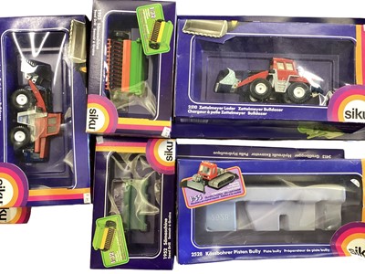 Lot 69 - Diecast boxed selection of SIKU models including farm machinery, Hydraulic Excavator, Combine Harvester etc. (24)