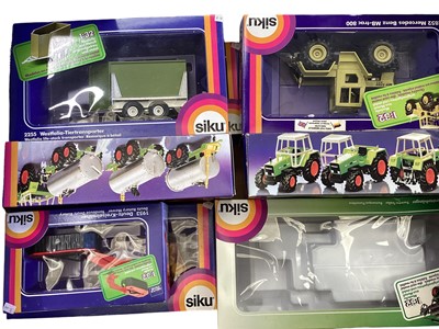 Lot 69 - Diecast boxed selection of SIKU models including farm machinery, Hydraulic Excavator, Combine Harvester etc. (24)