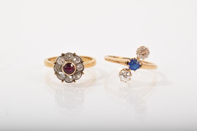 Lot 532 - Diamond and ruby flower head cluster ring and a sapphire and diamond three stone ring