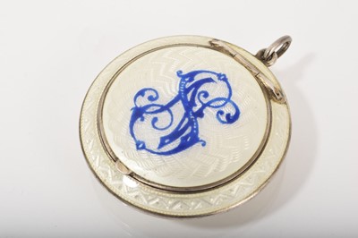 Lot 544 - Early 20th century Russian silver and guilloché enamel pendant powder compact of circular form with blue monogram on white enamel ground