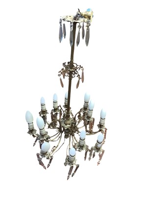 Lot 1517 - Large brass electrolier, with twelve lights hung with prismatic drops