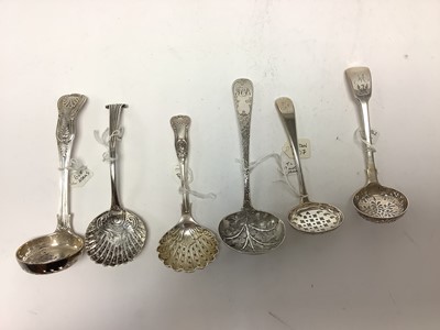 Lot 327 - Collection of six Georgian and later silver sugar sifting spoons to include an Onslow pattern spoon with pierced shell shape bowl by Hester Bateman, London 1776, two King's pattern ladles and th...