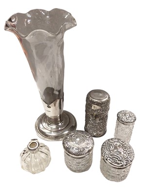 Lot 1053 - Silver mounted glass trumpet vase, four silver mounted glass jars/bottles and a silver plated embossed container engraved 'Mother, Nov 30 1896'