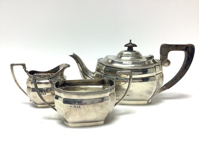 Lot 380 - Georgian-style silver three-piece teaset, London 1931, with beaded borders