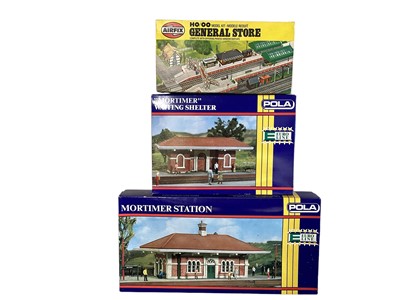 Lot 121 - Airfix OO Gauge General Store & Pola Mortimer Station model kits, plus trams & rolling stock (2 boxes)