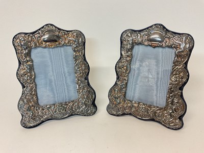 Lot 18 - Pair of silver photo frames, decorated in relief