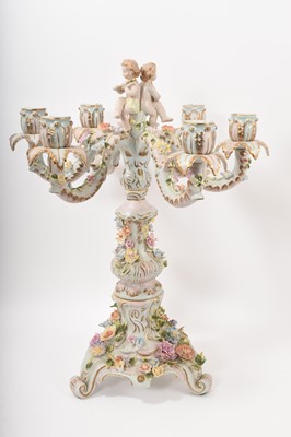 Lot 184 - Large Dresden six branch porcelain candelabra decorated with cherubs and flowers, 55cm high