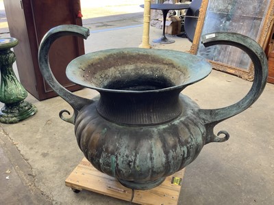 Lot 1317 - An impressive bronzed metal garden fountain in the form of a Classical two handled urn with fluted body, on circular pedestal base, 94cm high, 125cm wide