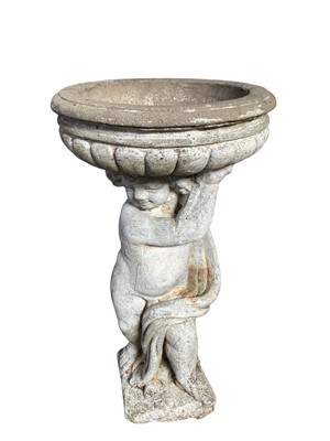 Lot 1321 - Garden bird bath of classical style, the fluted bowl supported by a putto, on square base, 92cm high