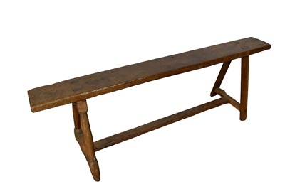 Lot 1537 - Long 19th century fruitwood bench, on trestle supports