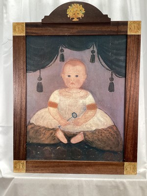 Lot 99 - American School early 20th century, A naive oil on canvas of a child sitting on a cushion, in a decorated wooden frame. 49 x 39cm.