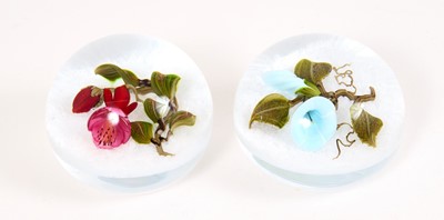 Lot 229 - Victor Trabucco, two glass paperweights, set with flowers on a white latticino ground, one signed 'Trabucco 2001'